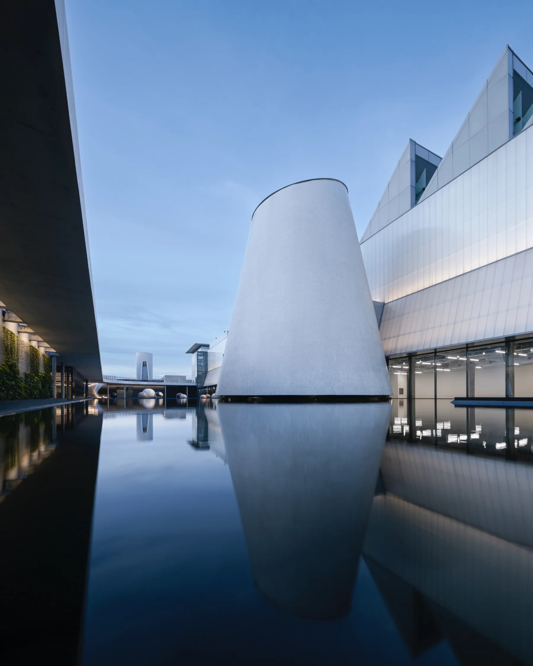 The sculptural architecture and reflecting pool at Dib Bangkok