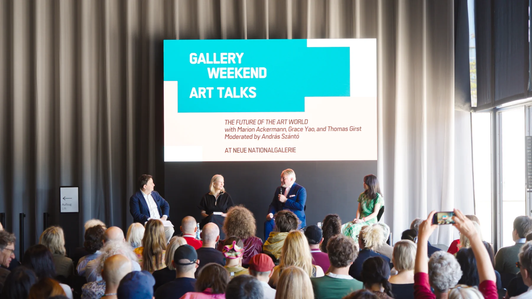 An Art Talks panel and its audience at Neue Nationalgalerie during Gallery Weekend Berlin